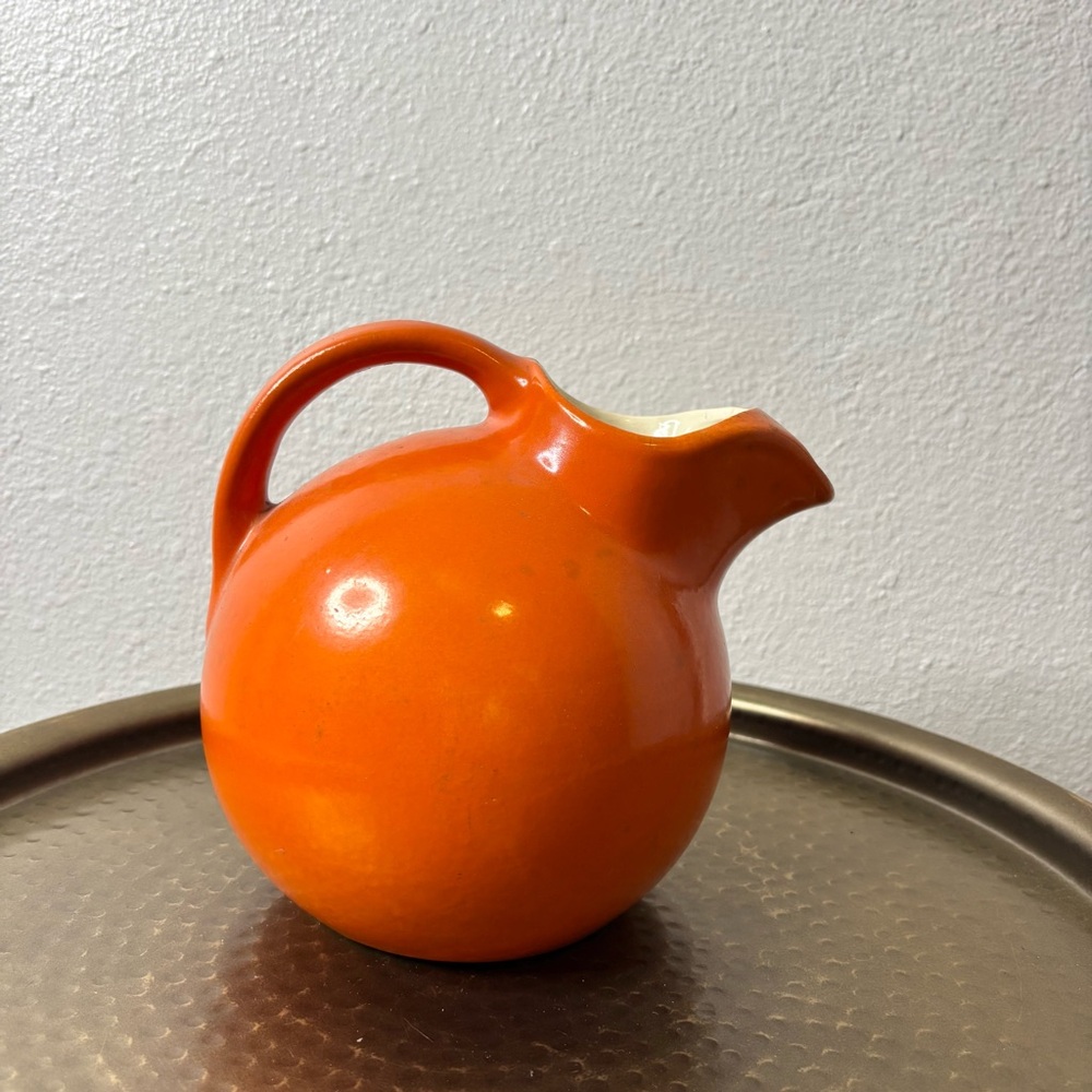 Vintage Rumrill pottery art deco orange tilt ball pitcher